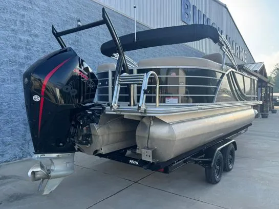 Slide: The Image of 2019 South Bay 521RS 3.0 pontoon boat on trailer, parked outside a marine building. - 9