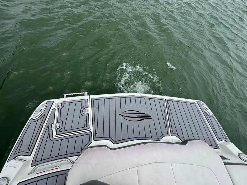 Slide: The Image of 2016 Chaparral 227 SSX boat deck on water, showcasing sleek design and craftsmanship. - 17