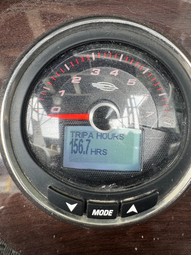 Slide: The Image of Close-up of a Chaparral 227 SSX 2016 boat tachometer displaying 156.7 trip hours. - 19