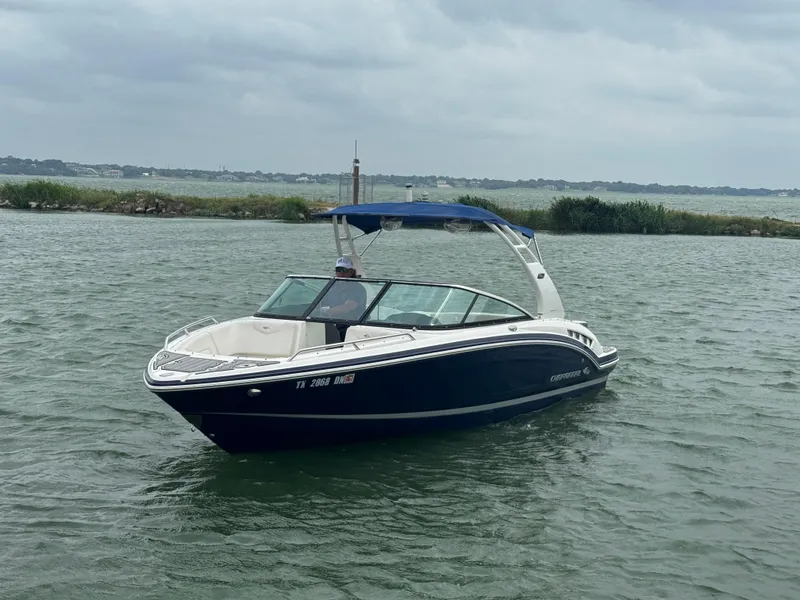Slide: The Image of 2016 Chaparral 227 SSX boat on a lake with cloudy skies. - 2