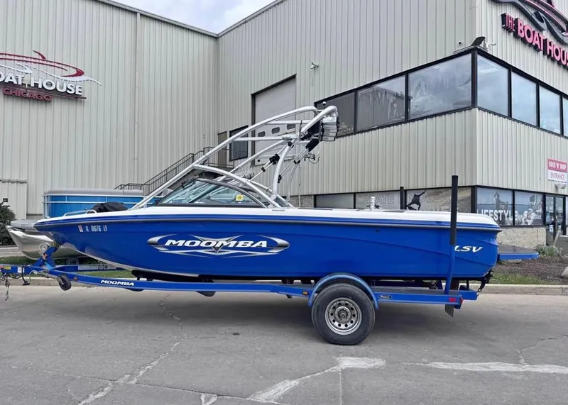 Slide: The Image of 2010 Moomba LSV boat in blue on trailer outside The Boat House. - 1