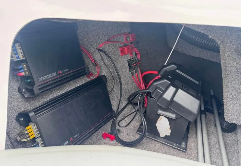 Slide: The Image of 2010 Moomba LSV boat audio system with Kicker amplifiers and wiring. - 12