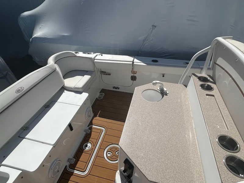 Slide: The Image of 2022 Sea Hunt Ultra 275 SE boat interior with seating and deck view. - 11