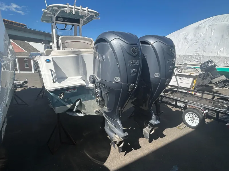 Slide: The Image of 2022 Sea Hunt Ultra 275 SE boat with dual Yamaha outboard engines. - 21