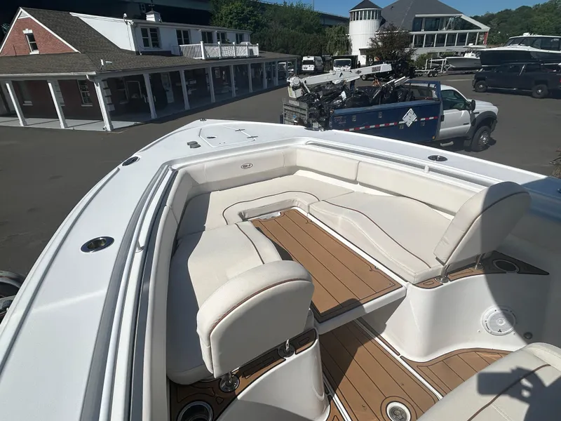 Slide: The Image of 2022 Sea Hunt Ultra 275 SE boat with spacious seating and elegant design. - 6