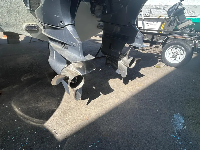 Slide: The Image of Twin propellers of a 2022 Sea Hunt Ultra 275 SE boat on a trailer. - 8