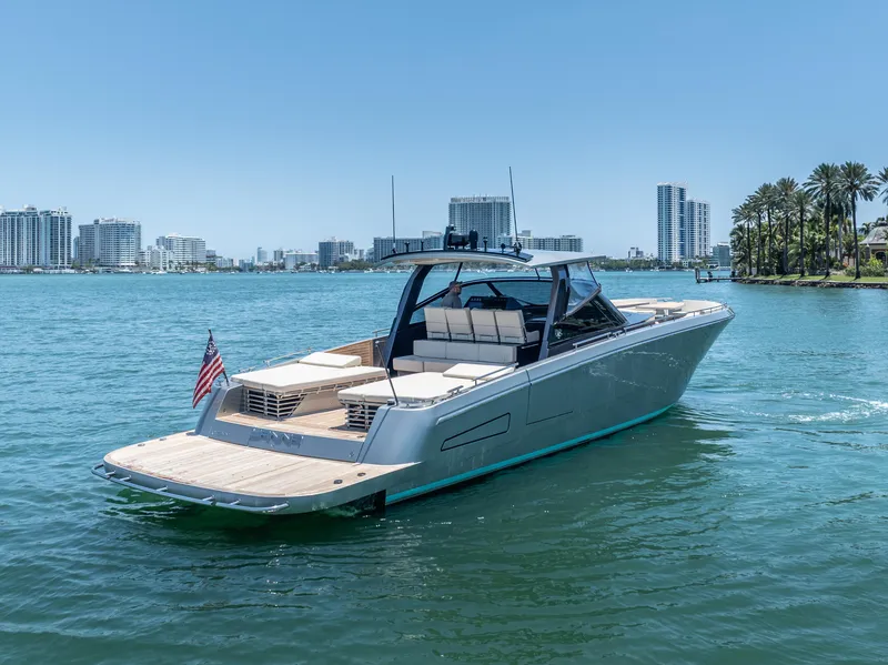 Slide: The Image of 2019 CNM Continental 54T yacht cruising in sunny waterfront cityscape. - 10