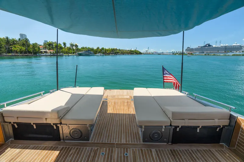 Slide: The Image of Luxurious 2019 CNM Continental 54T yacht deck with sun loungers and ocean view. - 13