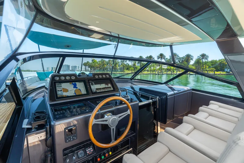 Slide: The Image of Luxurious 2019 CNM Continental 54T yacht cockpit with modern navigation system and plush seating. - 17