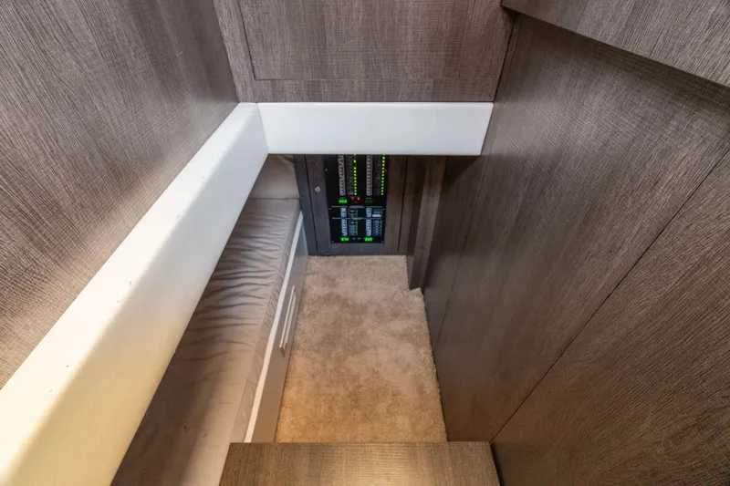 Slide: The Image of Interior view of 2019 CNM Continental 54T yacht with control panel and wooden finish. - 21