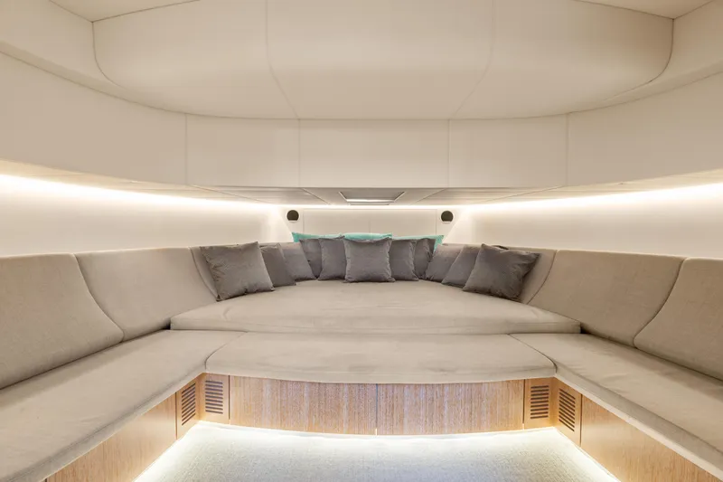 Slide: The Image of Luxurious interior of 2019 CNM Continental 54T yacht with plush seating and ambient lighting. - 4