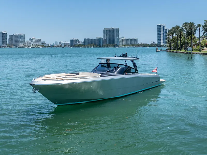 Slide: The Image of 2019 CNM Continental 54T yacht on water with city skyline in background. - 9