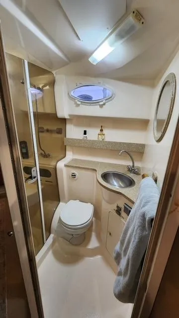 Slide: The Image of 2005 Rinker Fiesta Vee 342 bathroom with sink, toilet, and shower. - 14