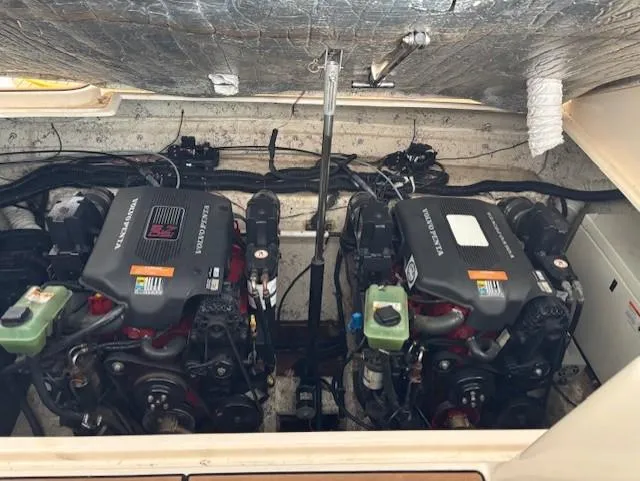 Slide: The Image of 2005 Rinker Fiesta Vee 342 engine compartment with dual engines and mechanical components. - 31