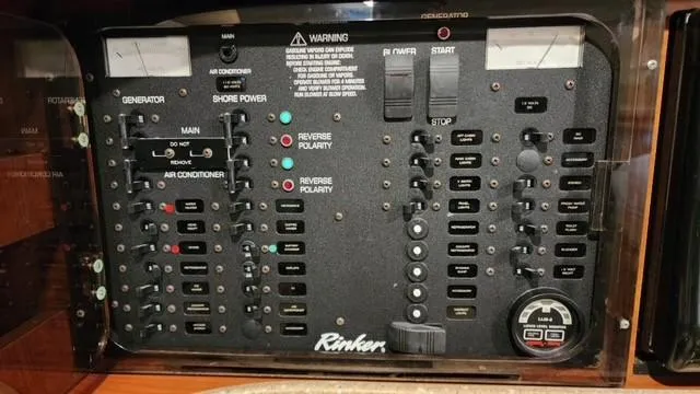 Slide: The Image of Control panel of 2005 Rinker Fiesta Vee 342 boat with various switches and indicators. - 32