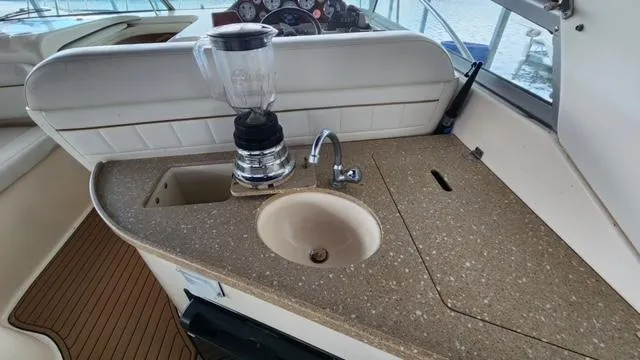 Slide: The Image of 2005 Rinker Fiesta Vee 342 boat kitchenette with sink and blender. - 6