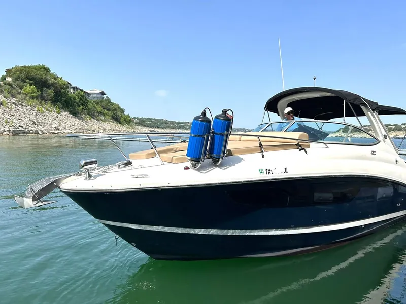 Slide: The Image of 2017 Sea Ray 280 Sundancer boat on calm water, scenic background. - 22