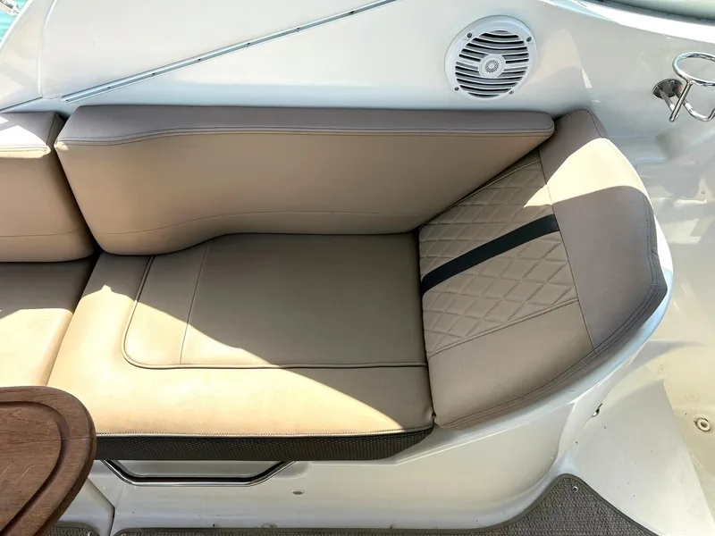 Slide: The Image of 2017 Sea Ray 280 Sundancer boat interior with beige seating and speaker. - 26