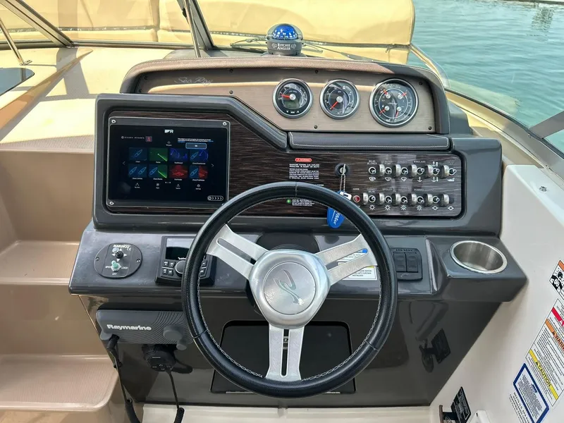 Slide: The Image of Helm of 2017 Sea Ray 280 Sundancer with modern controls and navigation system. - 35