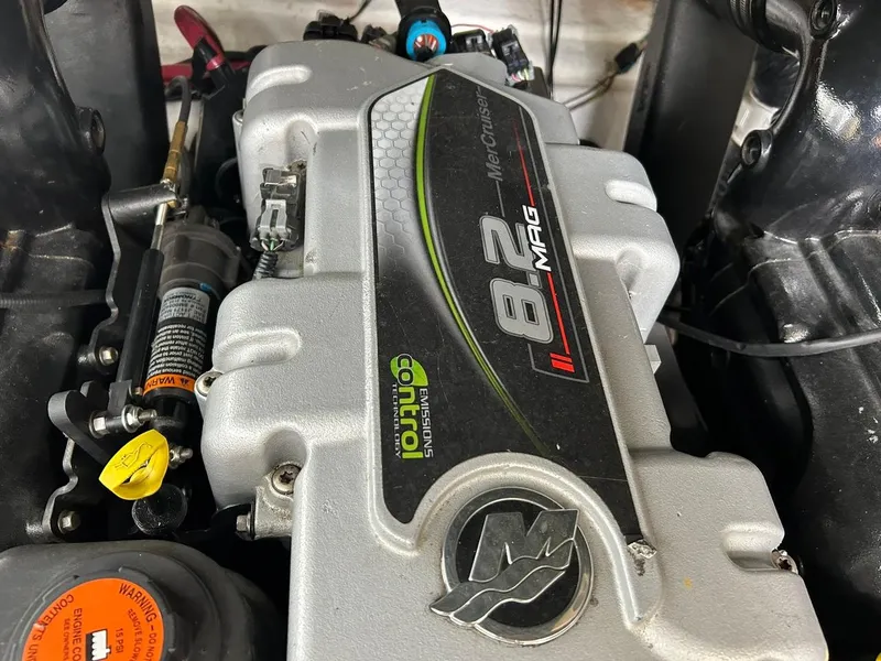 Slide: The Image of Engine of a 2017 Sea Ray 280 Sundancer boat, featuring a 8.2 MAG motor. - 40