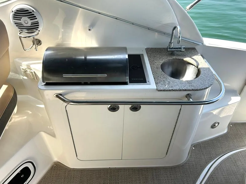 Slide: The Image of Outdoor kitchenette on 2017 Sea Ray 280 Sundancer boat with grill and sink. - 43