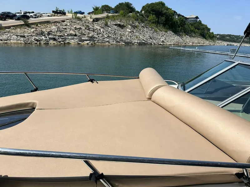Slide: The Image of 2017 Sea Ray 280 Sundancer boat with tan sunpad on a calm lake. - 47