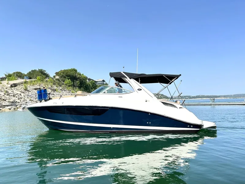 Slide: The Image of 2017 Sea Ray 280 Sundancer boat on calm water, clear sky background. - 7