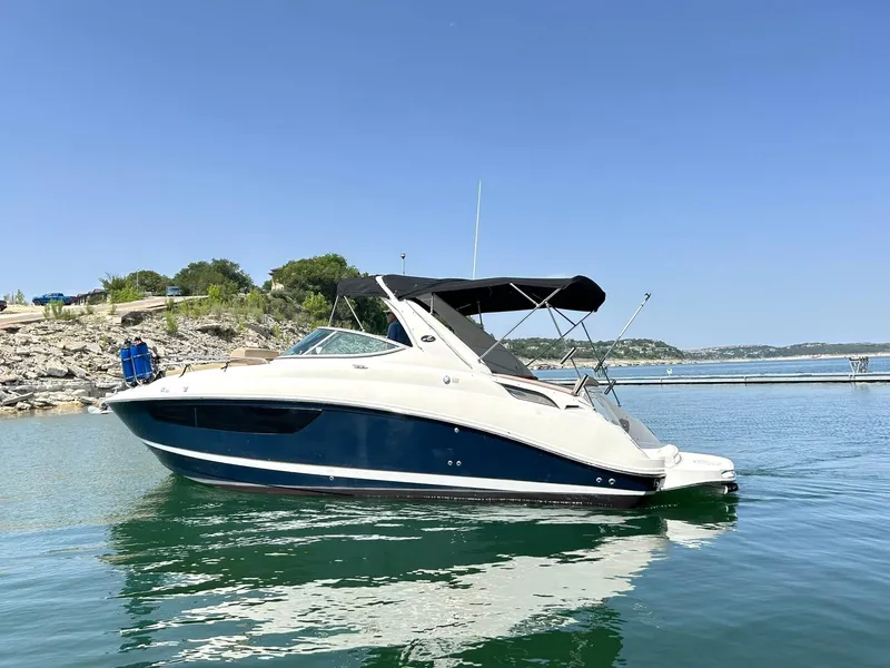 Slide: The Image of 2017 Sea Ray 280 Sundancer boat on calm water, clear sky background. - 8