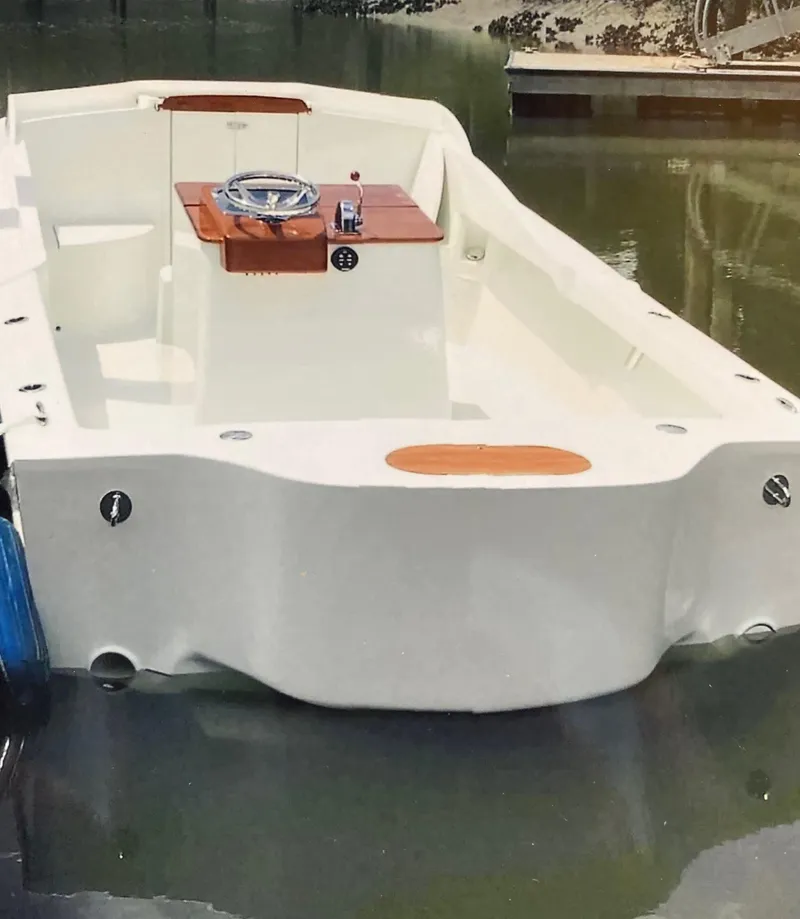 Slide: The Image of 2018 Blackfin Custom 25 boat docked on calm water. - 12