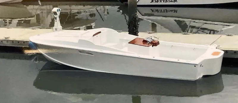 Slide: The Image of 2018 Blackfin Custom 25 boat docked in marina, sleek white design. - 13