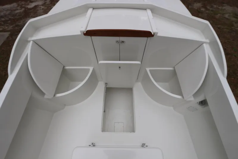 Slide: The Image of 2018 Blackfin Custom 25 boat interior with storage compartments and sleek white design. - 6