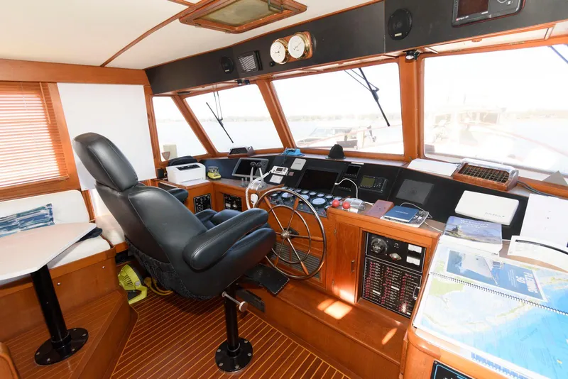 Slide: The Image of Interior of a 1990 Fleming 50 yacht helm with navigation equipment and captain's chair. - 22