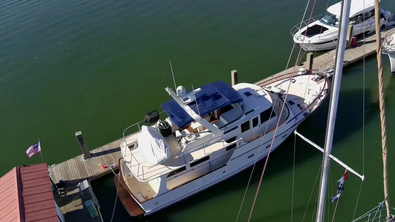 Slide: The Image of Aerial view of a 1990 Fleming 50 yacht docked at a marina. - 3