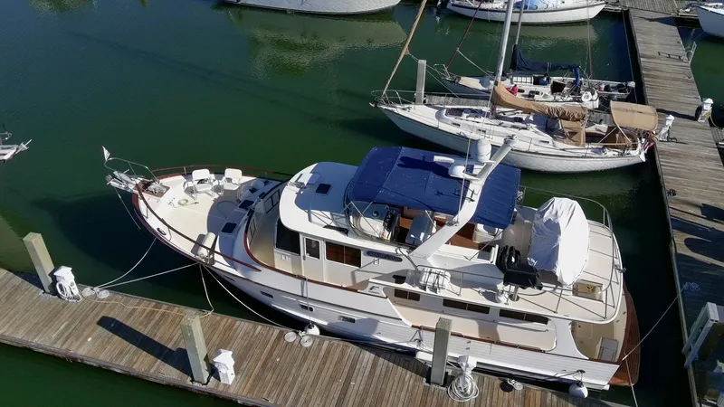 Slide: The Image of 1990 Fleming 50 yacht docked at marina, aerial view. - 4