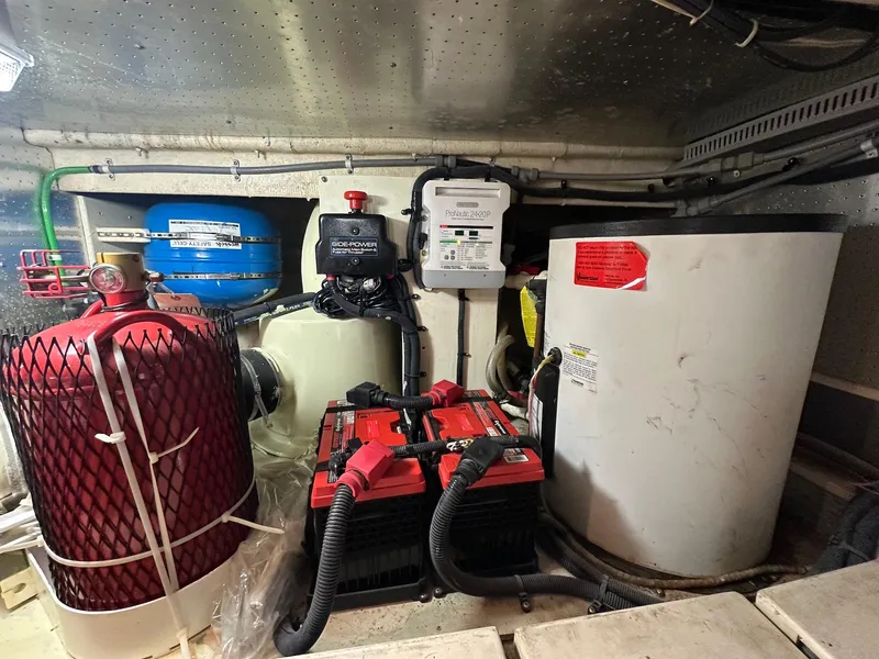 Slide: The Image of Engine room of a 1990 Fleming 50 yacht with batteries and equipment. - 42