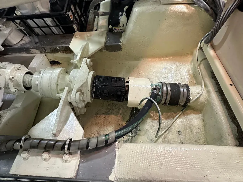 Slide: The Image of Engine room of a 1990 Fleming 50 yacht, showcasing mechanical components and wiring. - 45