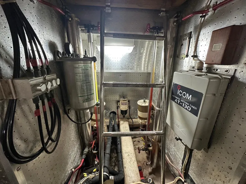 Slide: The Image of Engine room of a 1990 Fleming 50 yacht with equipment and wiring. - 46