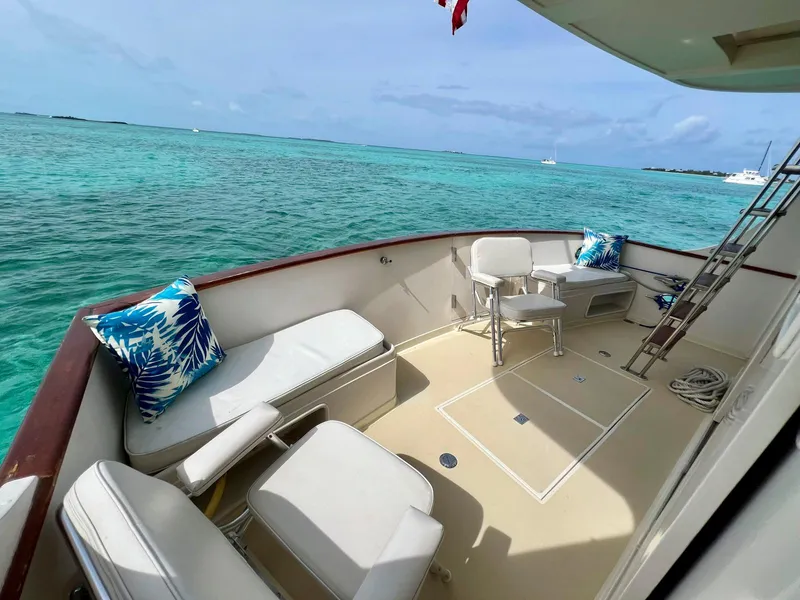 Slide: The Image of Fleming 50 yacht deck, 1990 model, with ocean view and seating area. - 6