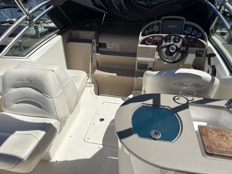 Slide: The Image of 2007 Sea Ray 270 Amberjack boat interior with helm, seating, and dashboard. - 11