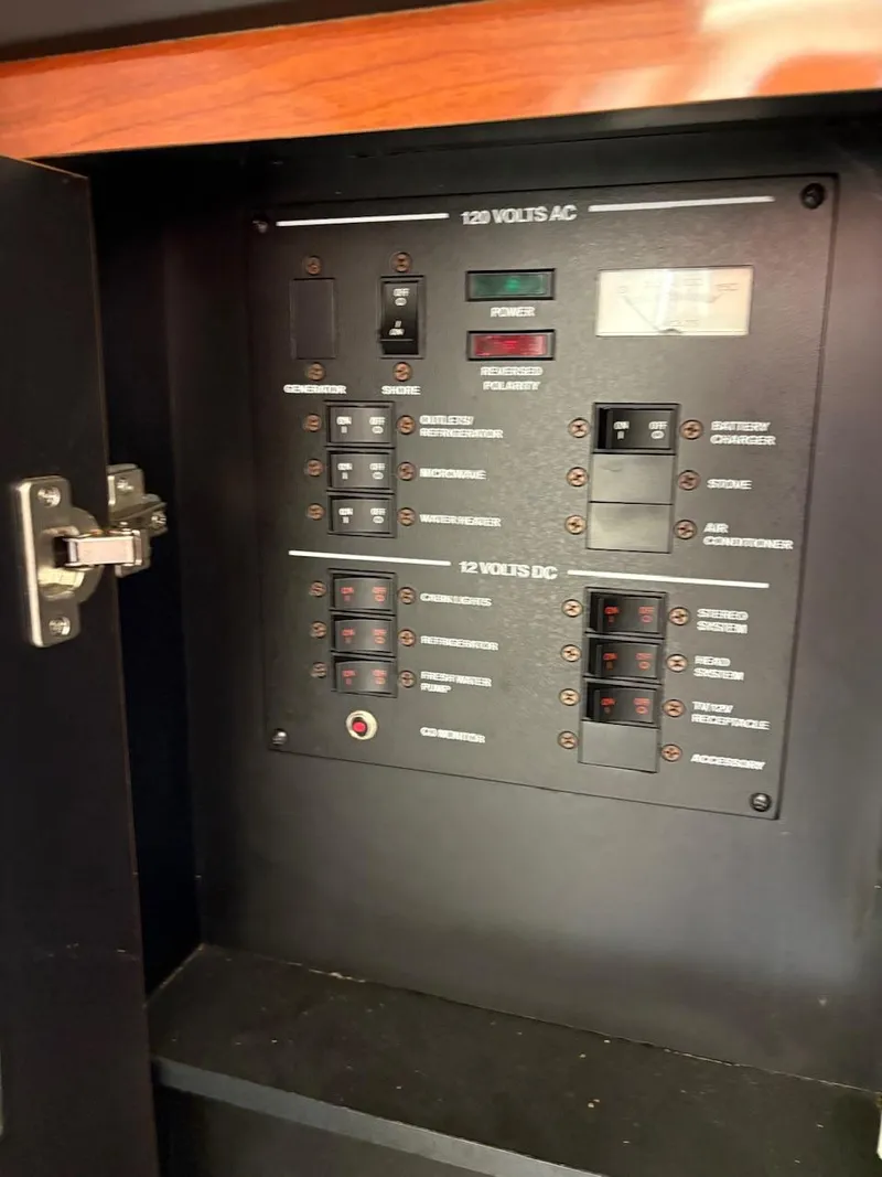 Slide: The Image of Electrical control panel inside a 2007 Sea Ray 270 Amberjack boat. - 6