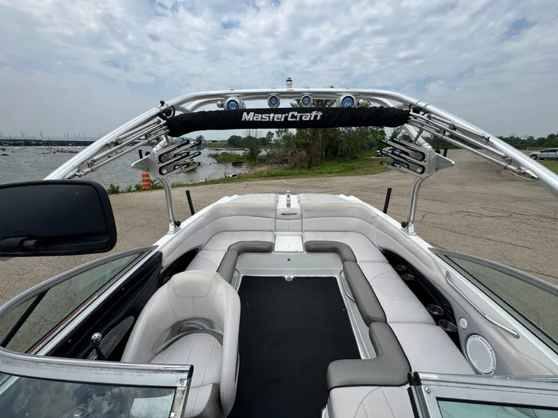 Slide: The Image of 2006 MasterCraft X30 boat interior with sleek seating and wakeboard tower. - 8