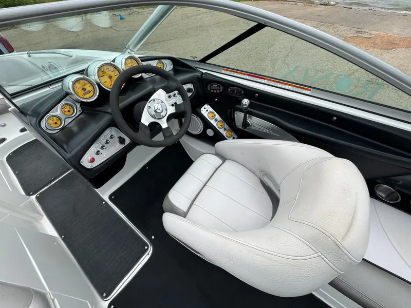Slide: The Image of 2006 MasterCraft X30 boat interior with steering wheel and dashboard gauges. - 9