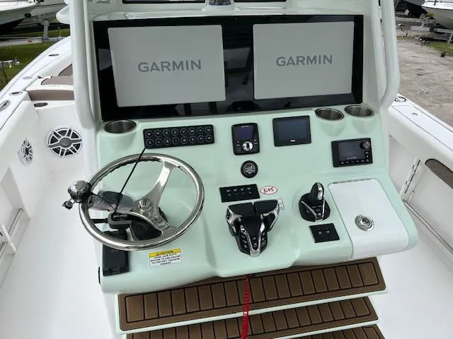 Slide: The Image of Control panel of 2025 Tidewater 3100 Carolina Bay boat with Garmin displays. - 4