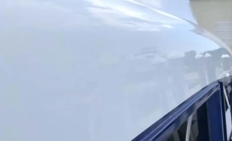 Slide: The Image of Close-up of a 1993 Palmer Johnson Sportfish yacht's sleek, glossy exterior. - 8