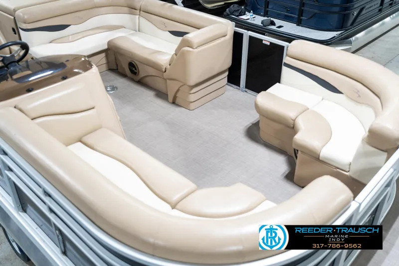 Slide: The Image of 2016 Bennington 20 SLMX pontoon boat with beige seating and spacious interior layout. - 13