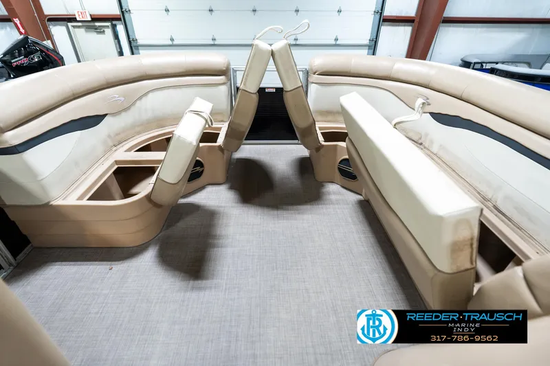Slide: The Image of Interior of a 2016 Bennington 20 SLMX pontoon boat with beige seating. - 22