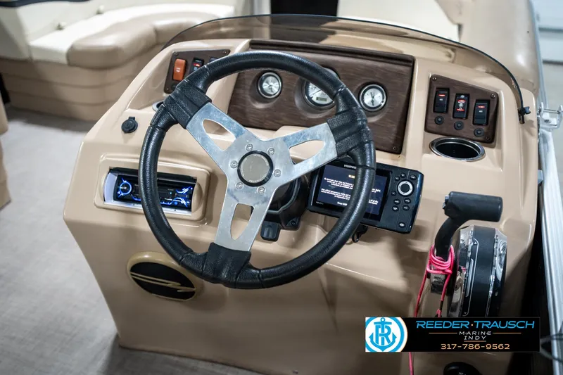 Slide: The Image of Steering console of a 2016 Bennington 20 SLMX boat with modern controls and gauges. - 30