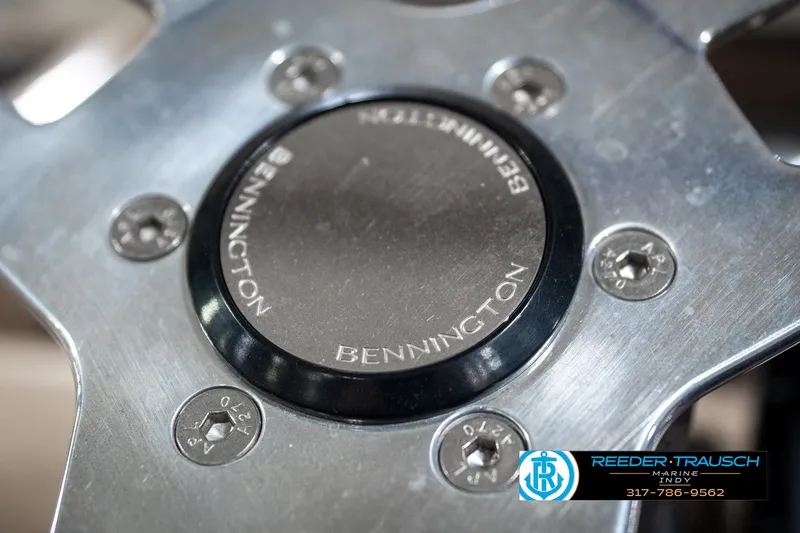 Slide: The Image of Close-up of 2016 Bennington 20 SLMX steering wheel with logo and screws. - 32