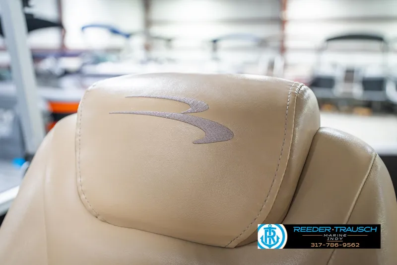 Slide: The Image of Beige leather seat with logo in a 2016 Bennington 20 SLMX boat. - 40