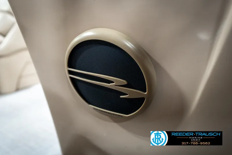 Slide: The Image of Speaker detail on 2016 Bennington 20 SLMX boat, featuring logo and beige interior. - 41